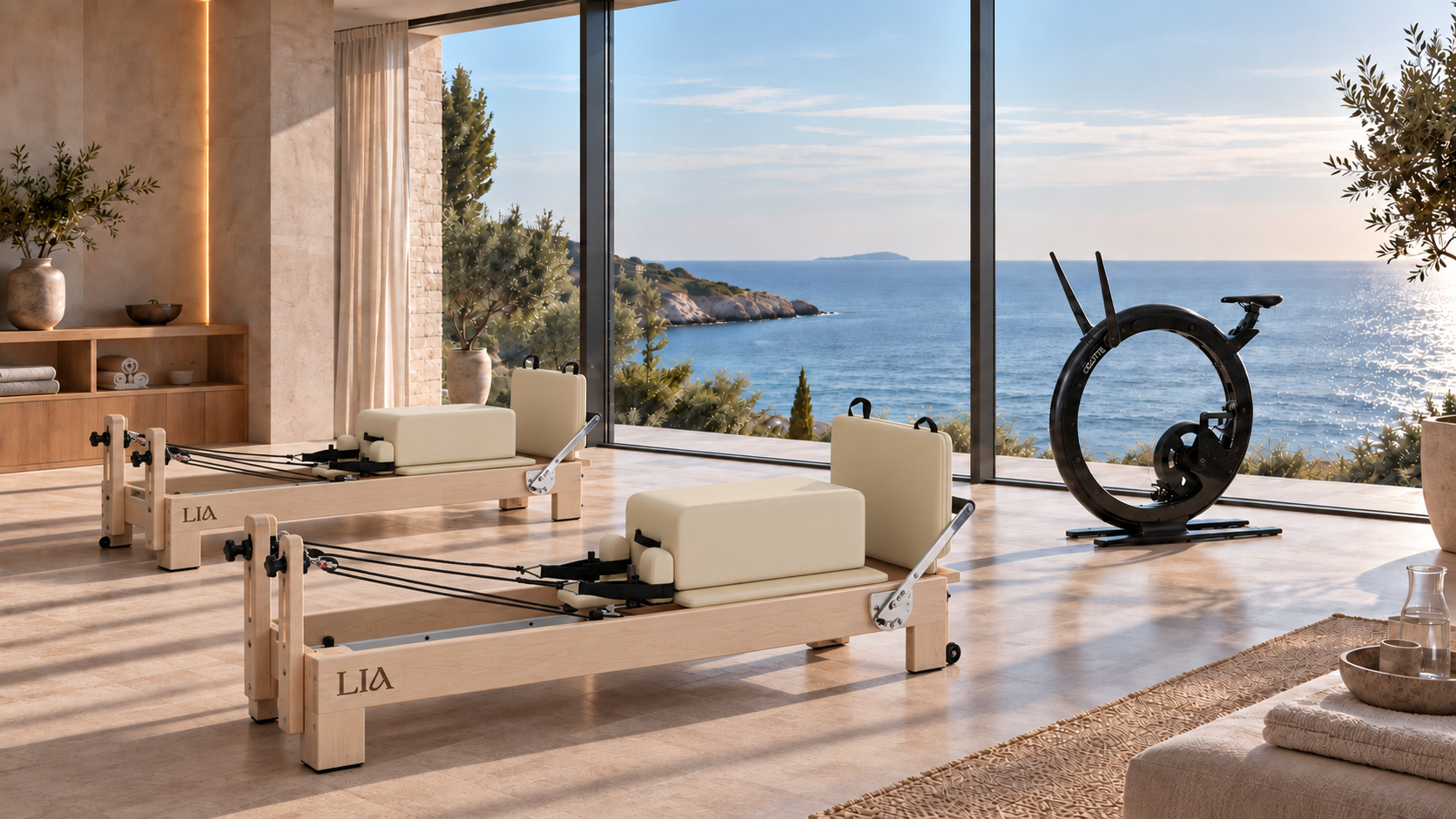 Concept of two cream Pilates reformers and a black Ciclotte bike overlooking the sea